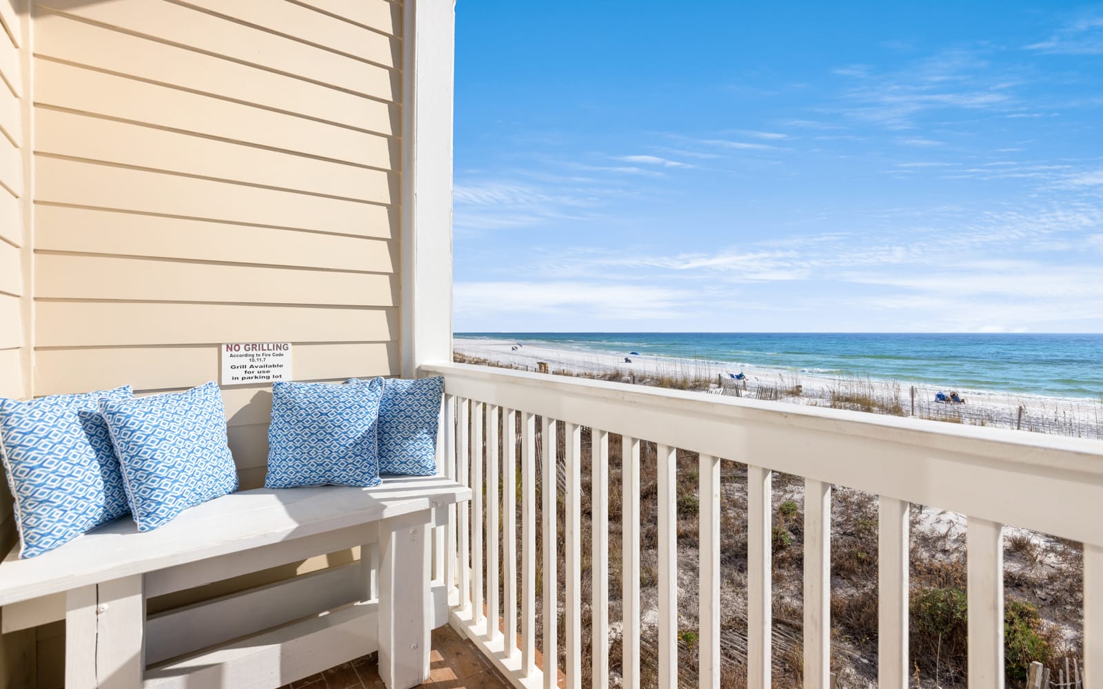 Gulf front balcony offers stunning ocean views and comfortable seating for your perfect coastal getaway.