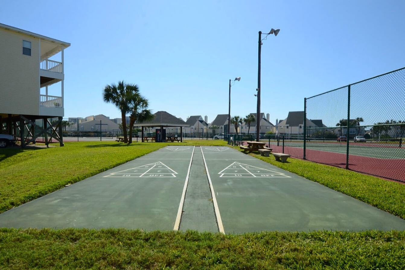Shuffleboard courts at Sandpiper Cove Resort, providing a fun, laid-back way to enjoy friendly competition and relaxed outdoor time in a sunny coastal setting.