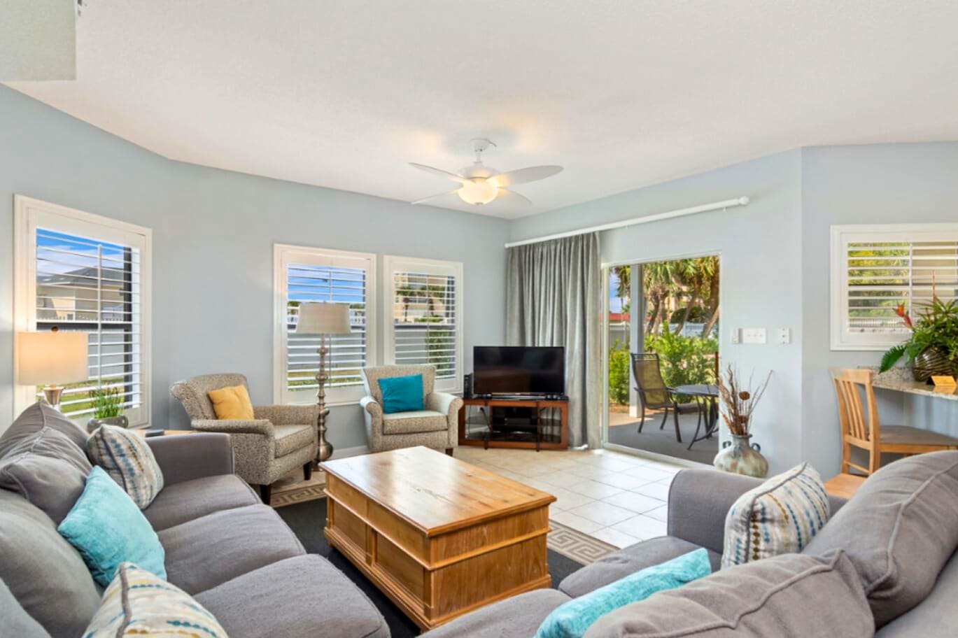 Sink into plush seating and unwind in your bright, airy living space with garden views and tropical breezes flowing through.