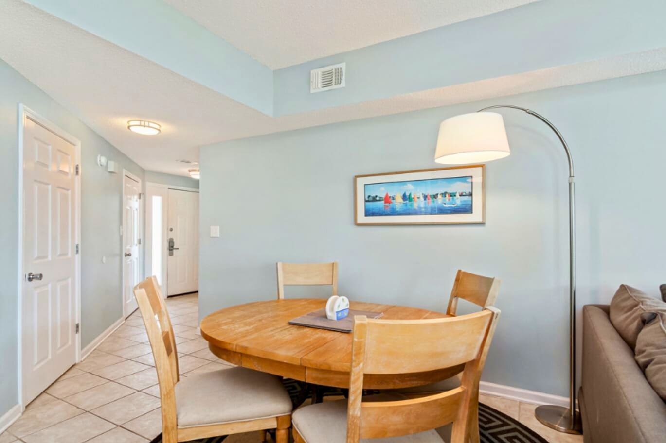 Gather around your bright dining space with comfortable seating for four and modern touches that make every meal feel special.