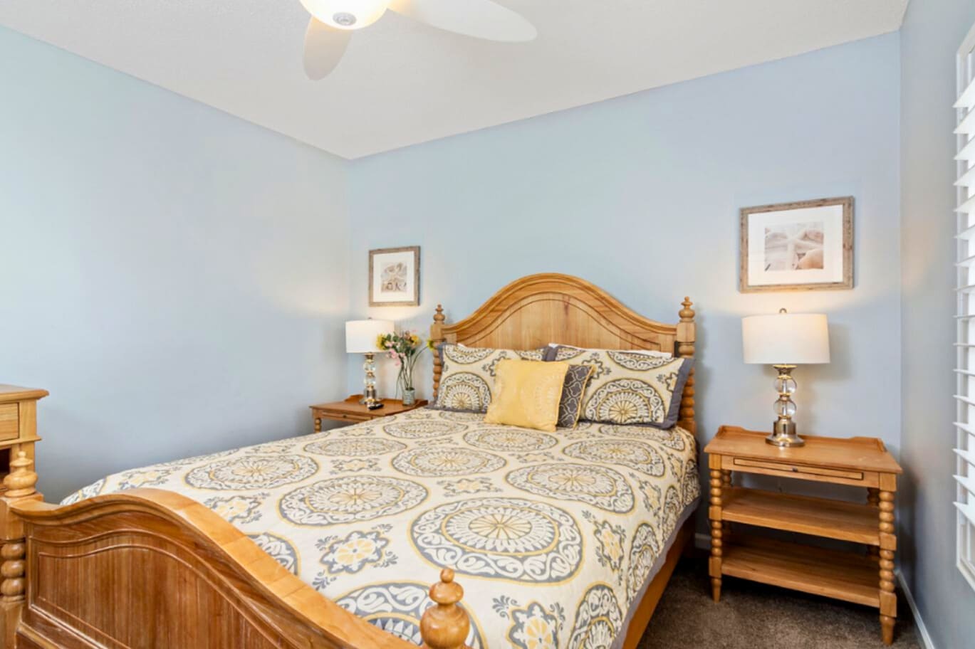 Sink into your comfortable bed surrounded by soothing blue walls and warm wooden furniture for the perfect night's rest.