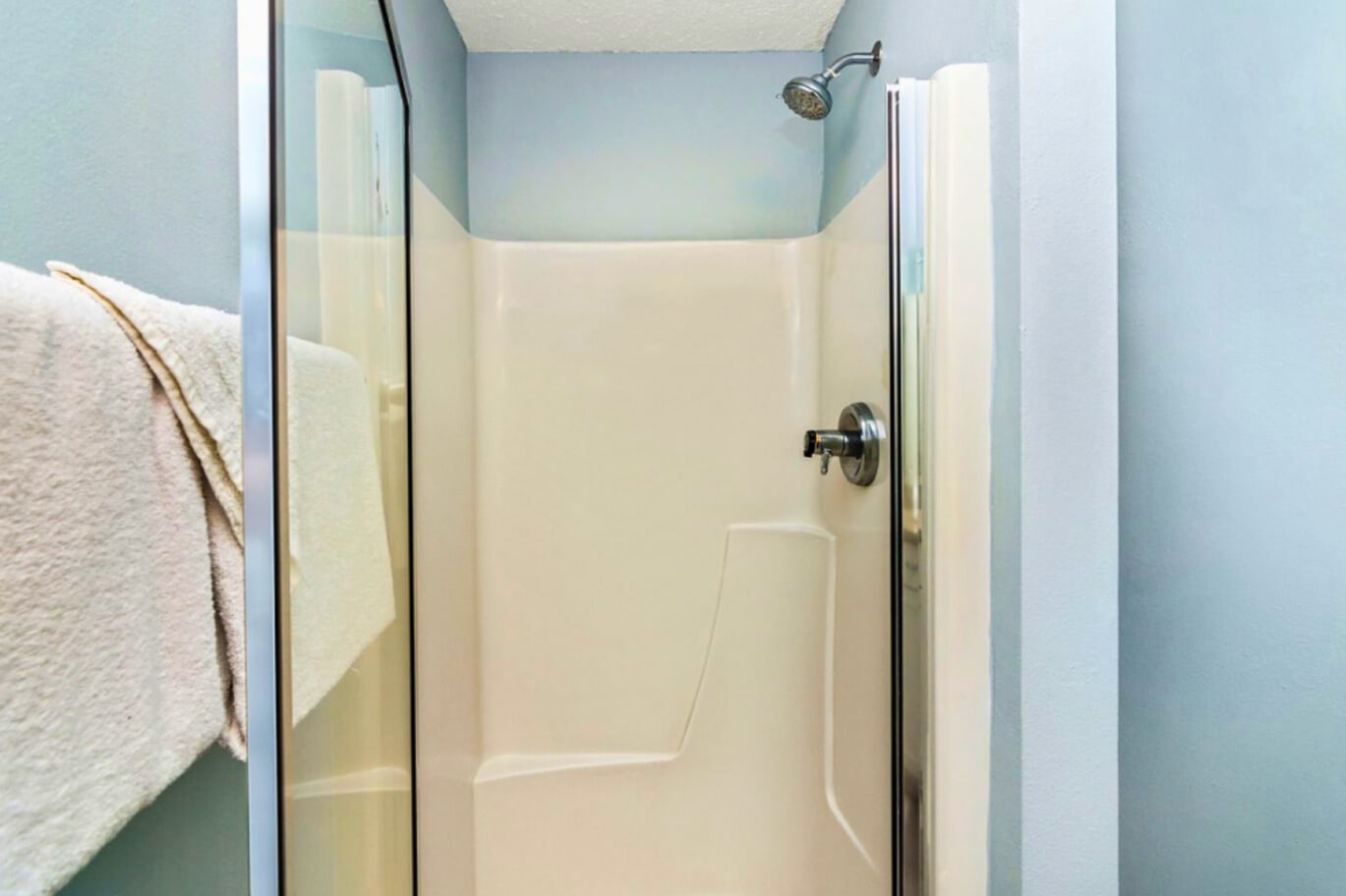 Your private shower features clean tile surroundings and modern fixtures for a refreshing start to each day.