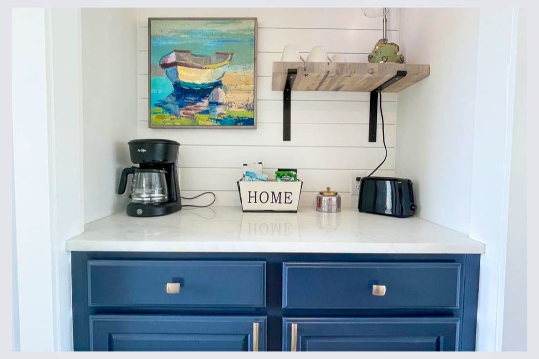 Your coastal-themed kitchenette features everything needed for morning coffee and light meals, with charming nautical touches throughout.