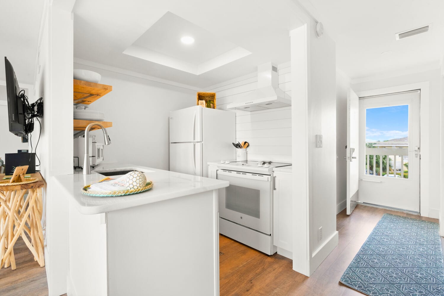 Your bright kitchen awaits with modern appliances and sleek countertops, perfect for preparing meals while enjoying the open-concept flow.