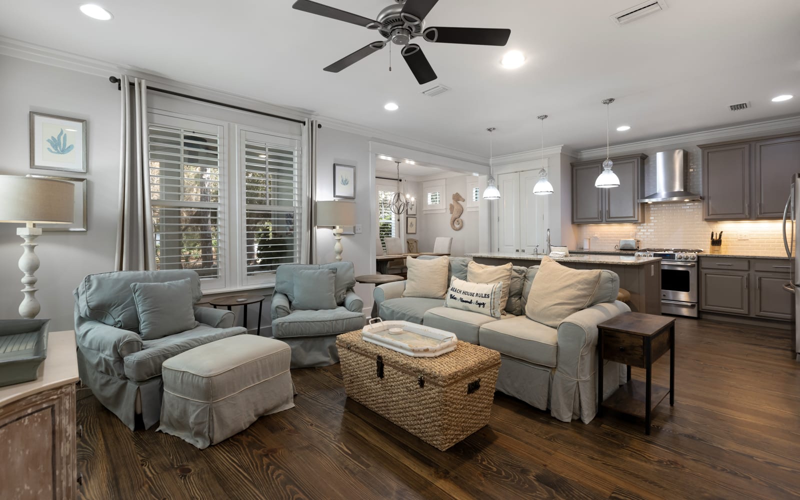 Sink into plush seating in this open-concept space where your living room flows seamlessly into a fully equipped kitchen, perfect for gathering.