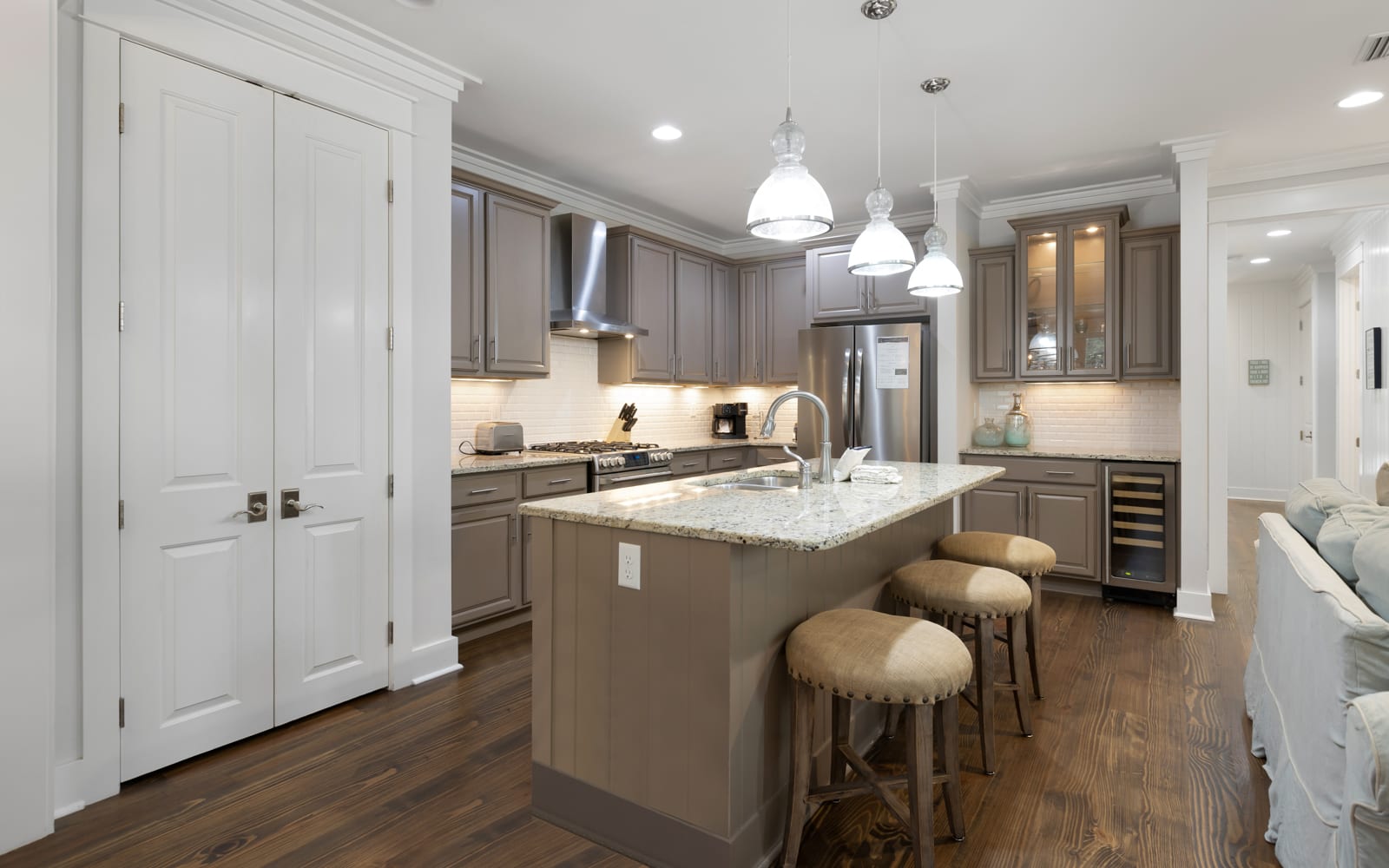 Your fully-equipped kitchen awaits with granite countertops, stainless appliances, and a breakfast bar perfect for morning coffee.