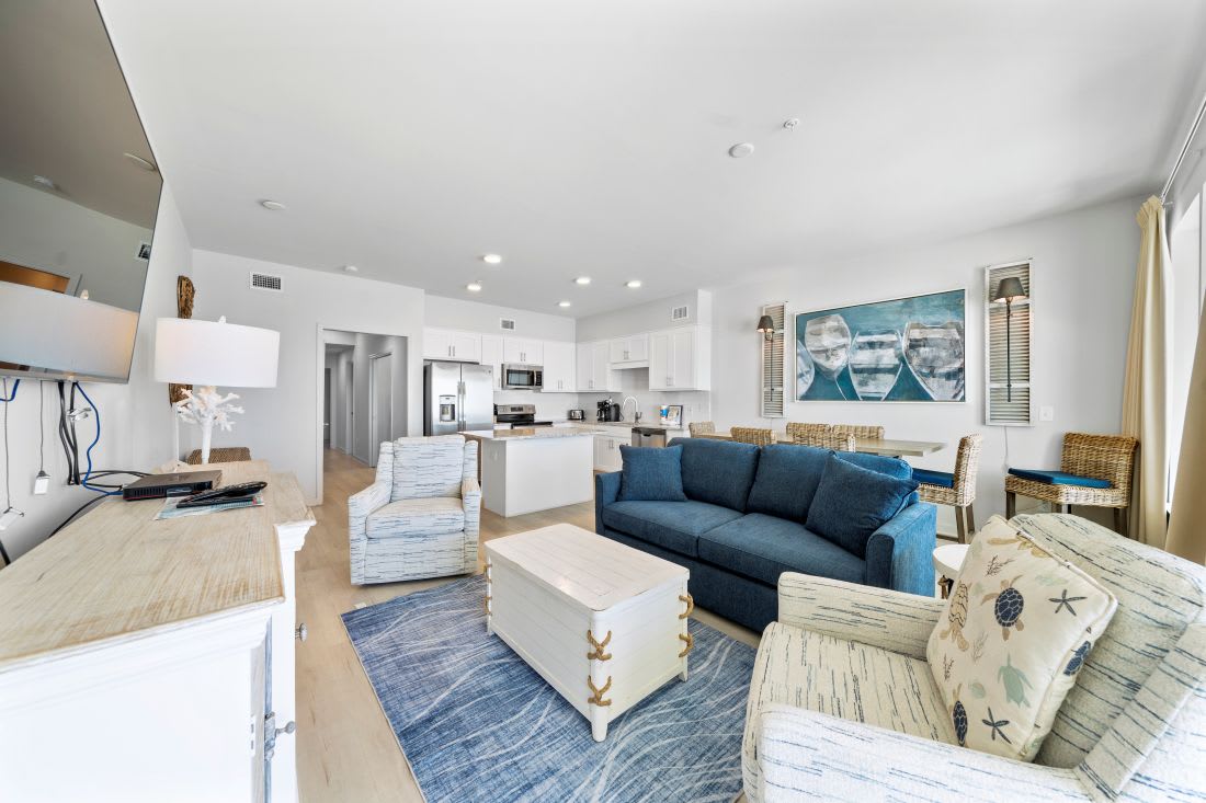 Unwind in your spacious open-plan haven where coastal blues meet crisp whites, perfect for relaxing after beach days.