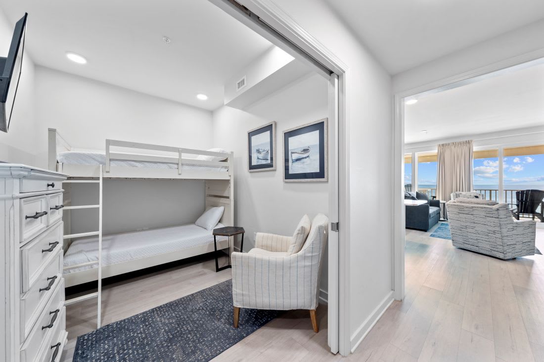 Your cozy bunk room features built-in storage and comfortable seating, perfect for kids or extra guests to unwind.