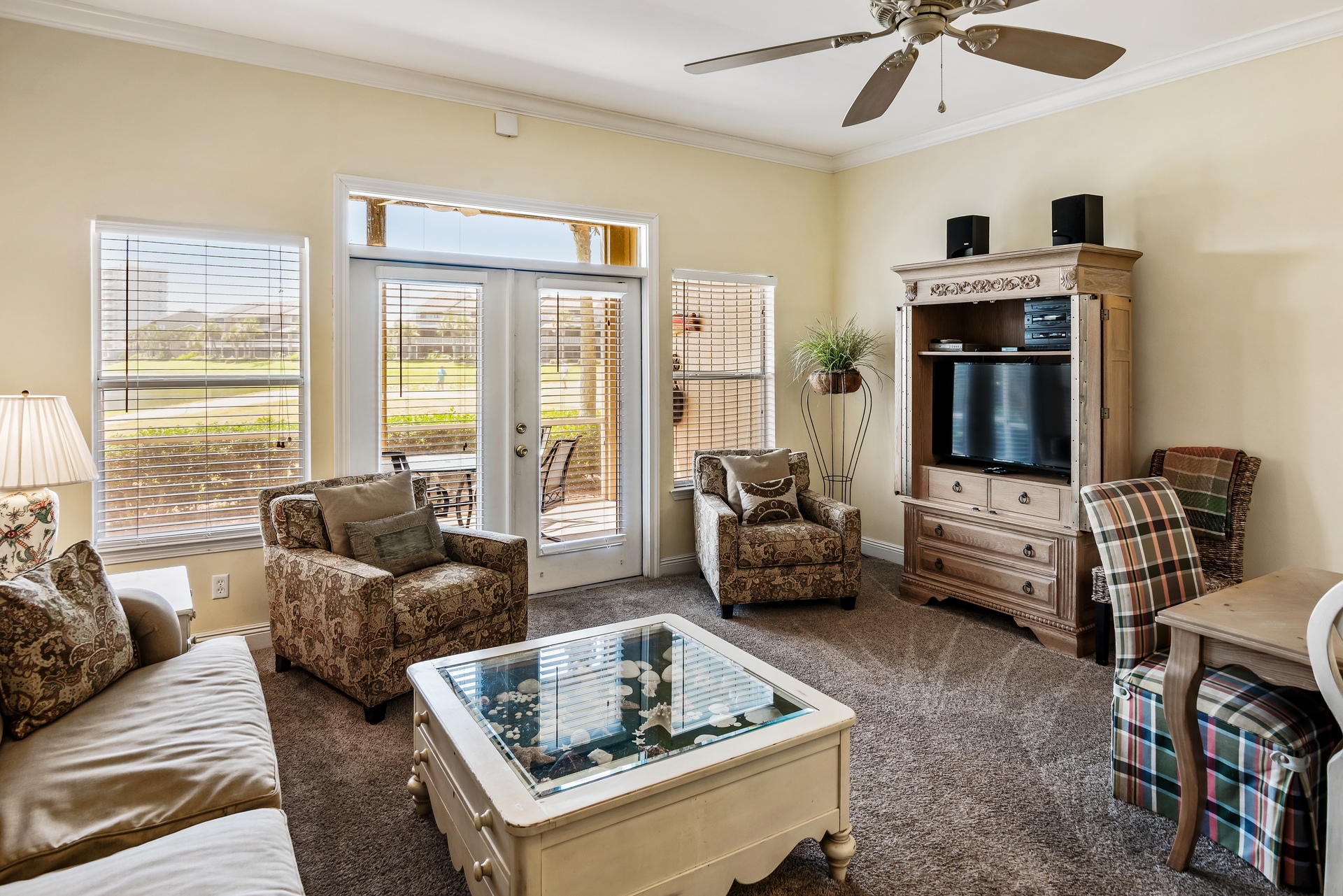 Spacious living room leads out to large screened in porch