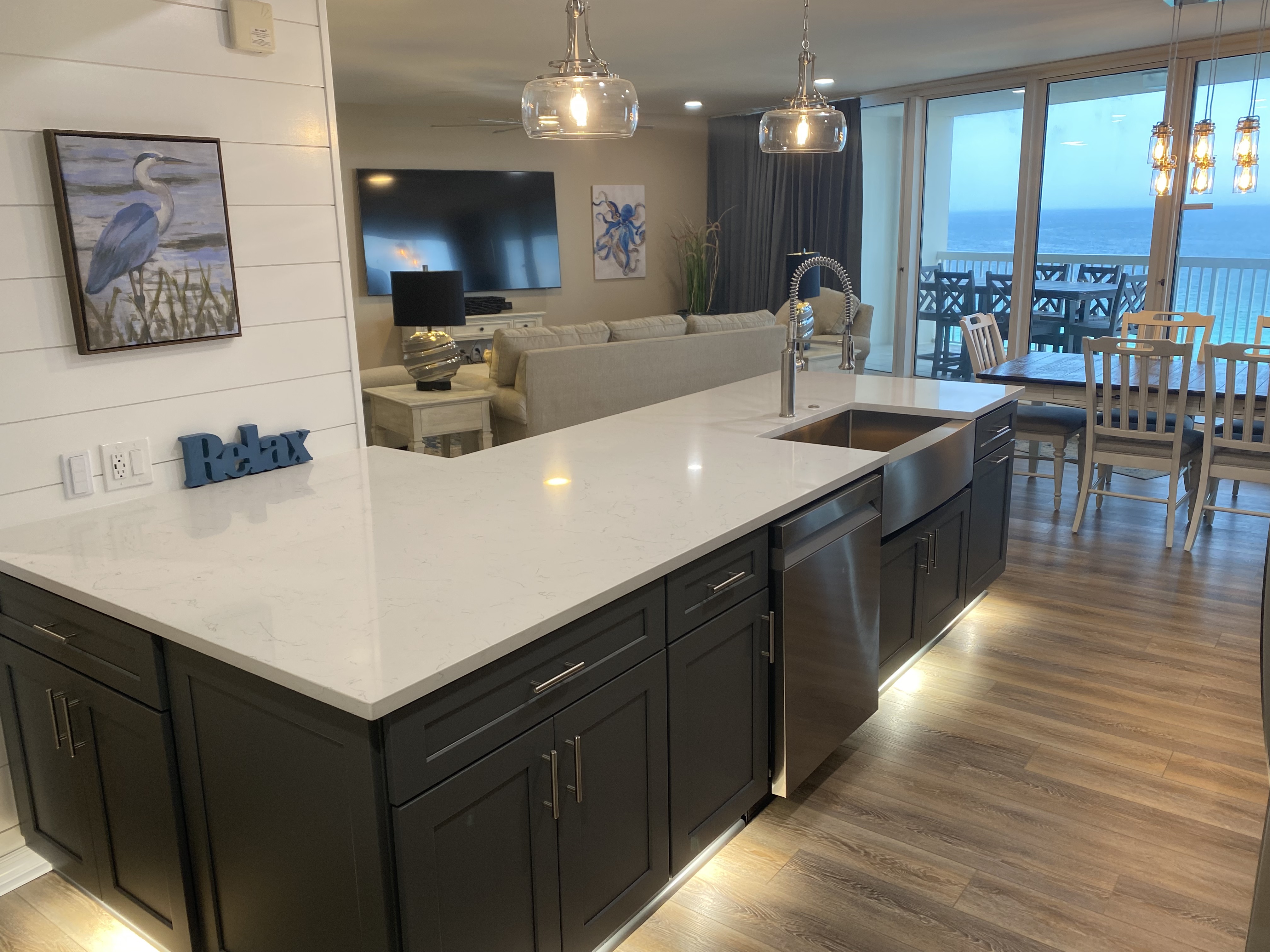 Quartz Countertops in kick-plate under counter kitchen - looking to living area