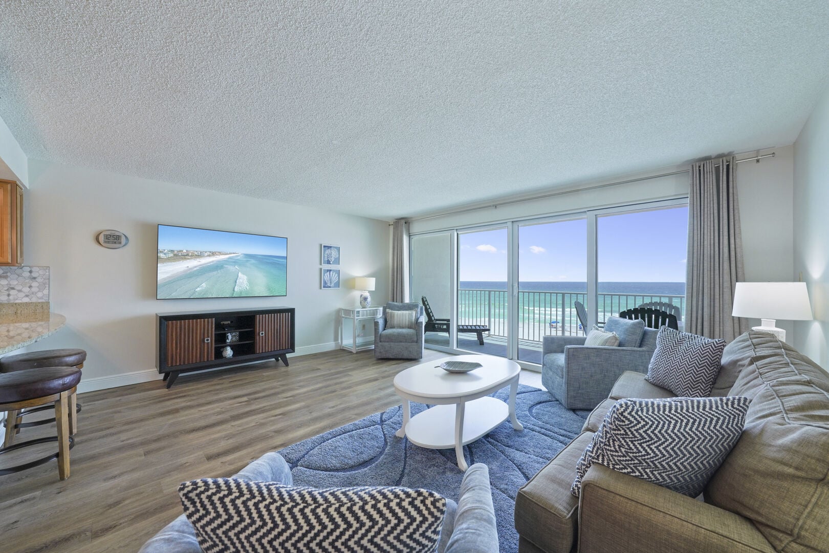 Perfect for relaxing after a beach day, the living room offers comfortable seating and front row views of the Emerald Coast.