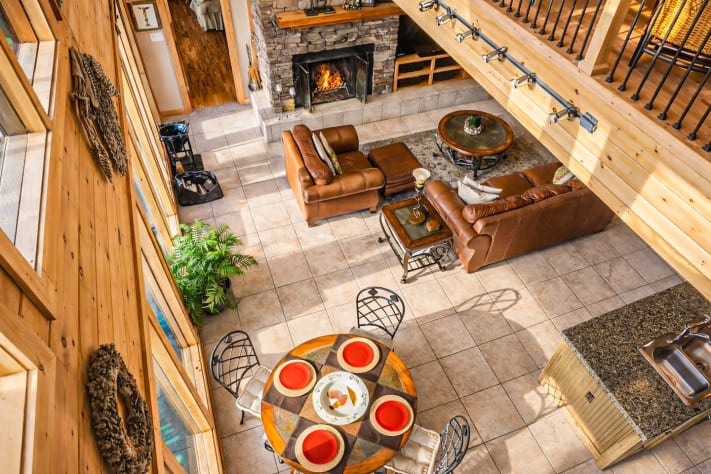 Third floor view to the second floor Great Room, fireplace, 4K TV, and views. Pigeon Forge, Tennessee Lodge Rental - Gallery Image #21