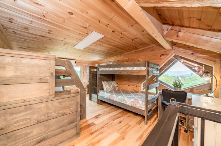 Loft with one day bed, one set of twin bunks, and one set of twin over double bunks. Pigeon Forge, Tennessee Cabin Rental - Gallery Image #25