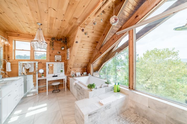 Primary bedroom bathroom with large shower and bathtub. Pigeon Forge, Tennessee Cabin Rental - Gallery Image #23