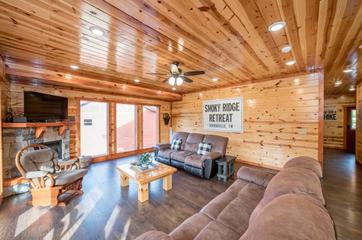 Enjoy an afternoon nap or time with family in the spacious living room. Pigeon Forge, Tennessee Cabin Rental - Gallery Image #12