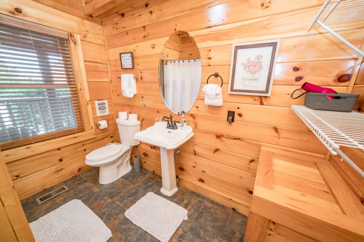 Full bathroom located on hallway of main floor Pigeon Forge, Tennessee Cabin Rental - Gallery Image #21