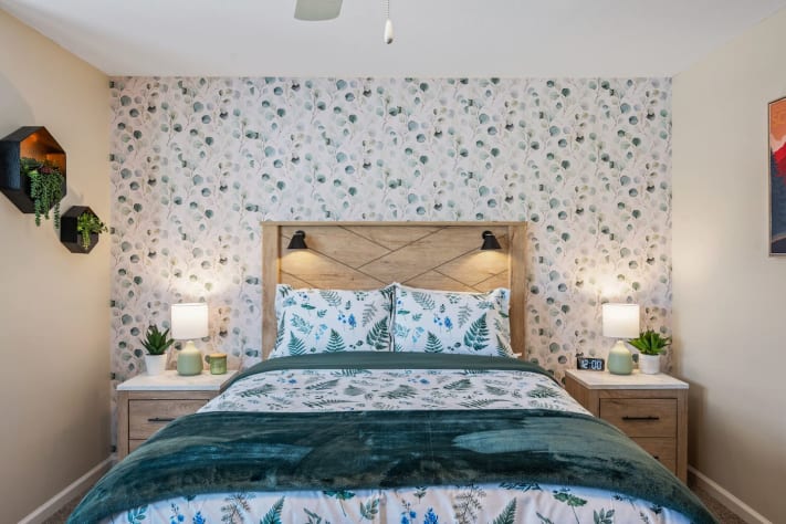 This bedroom is a serene retreat ????? — the nature-inspired wallpaper and bedding… Pigeon Forge, Tennessee Cabin Rental - Gallery Image #11