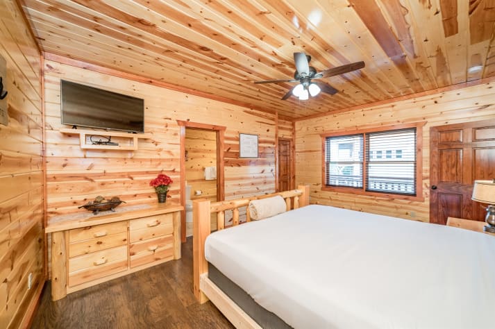 Bedroom 1 with Tv and full bathroom Pigeon Forge, Tennessee Cabin Rental - Gallery Image #17