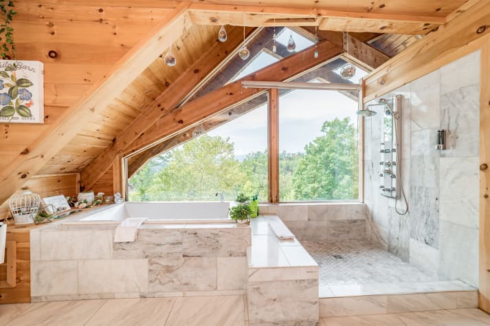 Tub in the main level bedroom Pigeon Forge, Tennessee Cabin Rental - Gallery Image #15