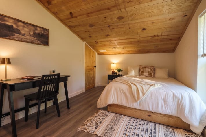 Bedroom with a dedicated desk — easy for guests mixing work with a week on the lake. Douglas Lake, Tennessee Cabin Rental - Gallery Image #35