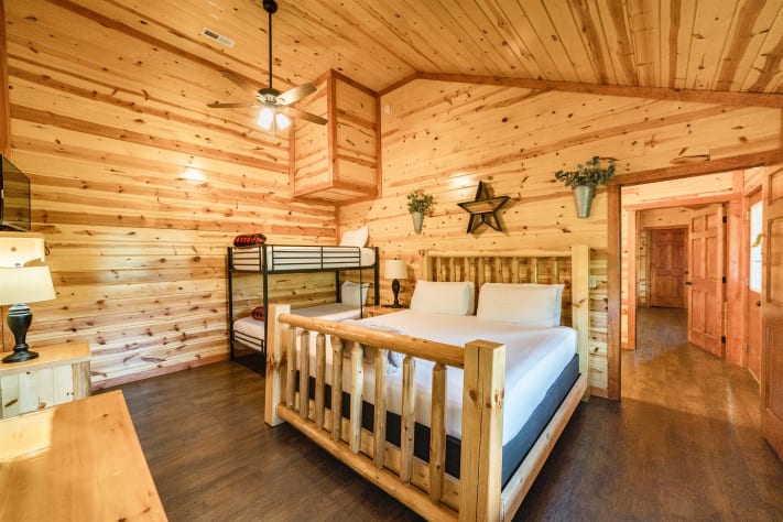 Bedroom 5: king bed with twin bunks and tv and full bathroom Pigeon Forge, Tennessee Cabin Rental - Gallery Image #32