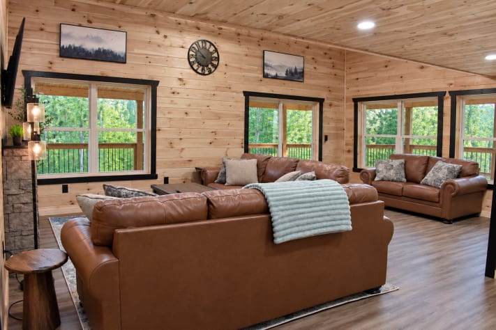 A second living room with plenty of seating for the whole group, wrapped in windows… Sevierville, Tennessee Cabin Rental - Gallery Image #16