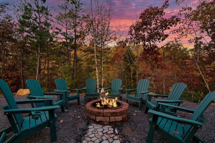 Gather around the stone firepit under the trees — Adirondack seating for the whole… Sevierville, Tennessee Cabin Rental - Gallery Image #35