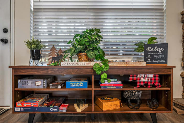 This cozy game nook invites relaxation and fun! ???? With board games, books, and… Pigeon Forge, Tennessee Cabin Rental - Gallery Image #29
