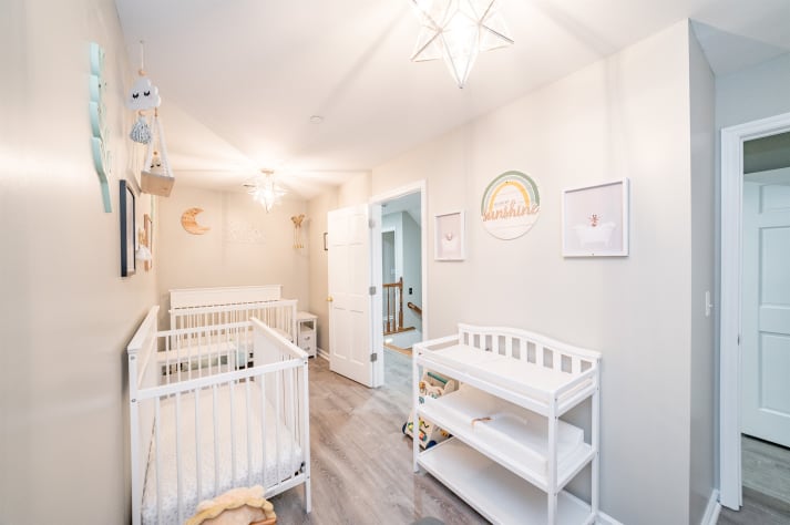 Nursery located near the master bedroom. Featuring 2 cribs, changing table, and… Sevierville, Tennessee Cabin Rental - Gallery Image #36