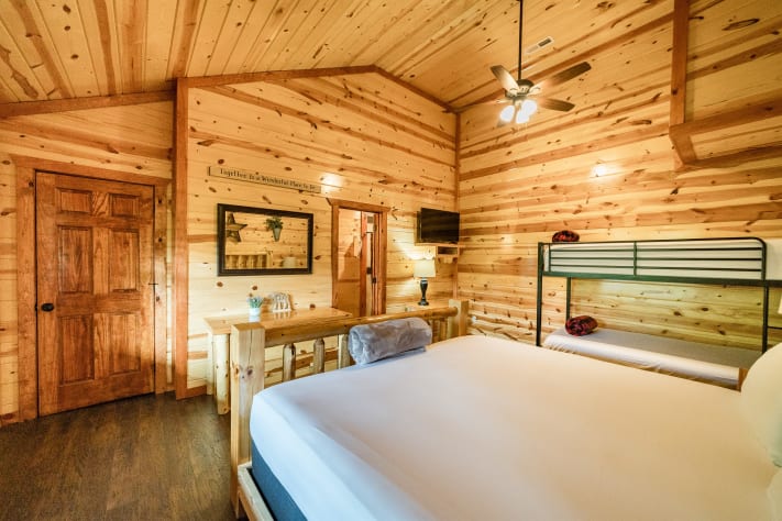 Bedroom 5: king bed with twin bunks and tv and full bathroom Pigeon Forge, Tennessee Cabin Rental - Gallery Image #31