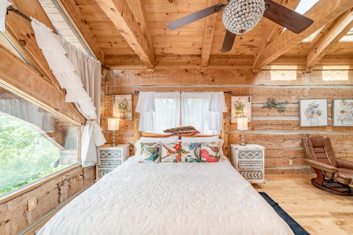 Bed in primary bedroom Pigeon Forge, Tennessee Cabin Rental - Gallery Image #22