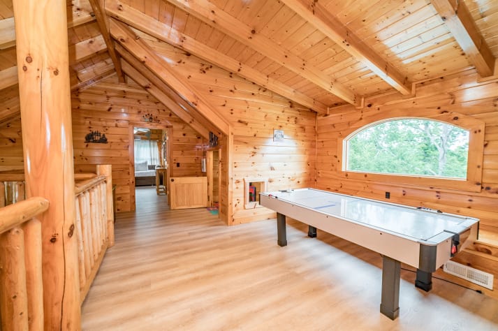 Common space on the top floor featuring a reading nook, children's play area, and… Pigeon Forge, Tennessee Cabin Rental - Gallery Image #29