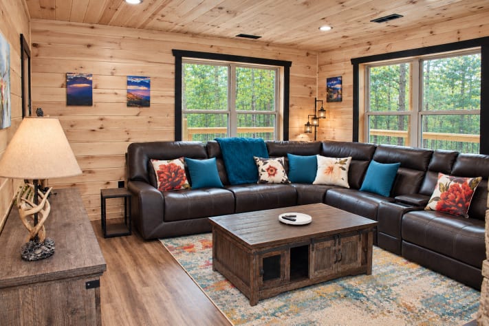 Sink into the oversized leather sectional with room for the whole crew, surrounded… Sevierville, Tennessee Cabin Rental - Gallery Image #4