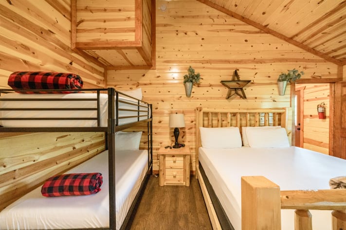 Bedroom 5: king bed with twin bunks and tv and full bathroom Pigeon Forge, Tennessee Cabin Rental - Gallery Image #35