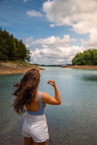 Swimming off the lake access on a summer afternoon — calm cove water with the Smoky… Douglas Lake, Tennessee Cabin Rental - Gallery Image #9