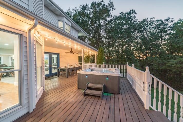 The back porch at sundown, check out those lights! Sevierville, Tennessee Cabin Rental - Gallery Image #7