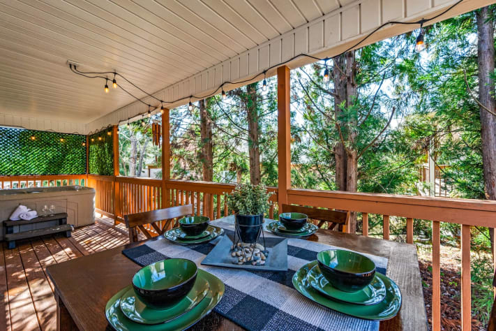 Enjoy a meal or a drink surrounded by nature, or soak in the hot tub just steps… Pigeon Forge, Tennessee Cabin Rental - Gallery Image #7