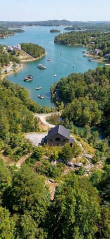 Aerial view of the barndominium above its Douglas Lake cove — wooded privacy on… Douglas Lake, Tennessee Cabin Rental - Gallery Image #8