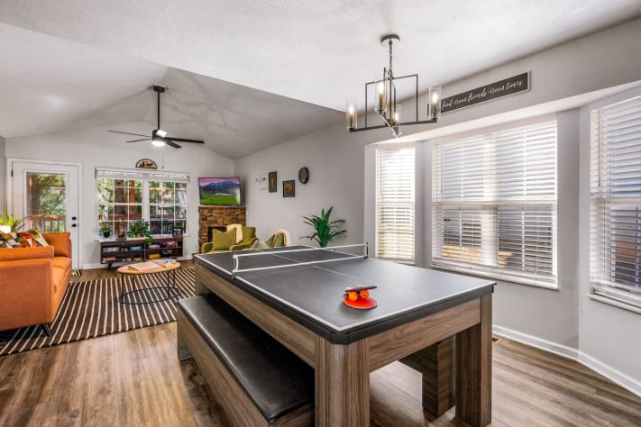 Bright and inviting game room with a convertible pool and ping pong table, cozy… Pigeon Forge, Tennessee Cabin Rental - Gallery Image #23