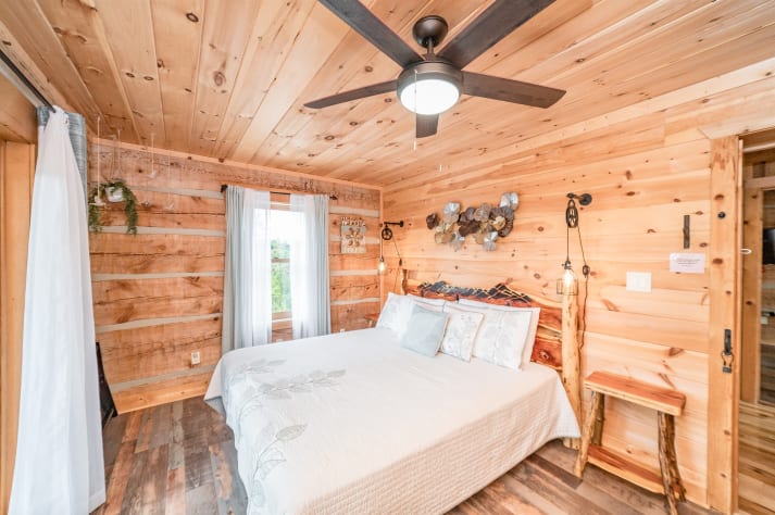King bedroom on main level.  Pigeon Forge, Tennessee Cabin Rental - Gallery Image #33
