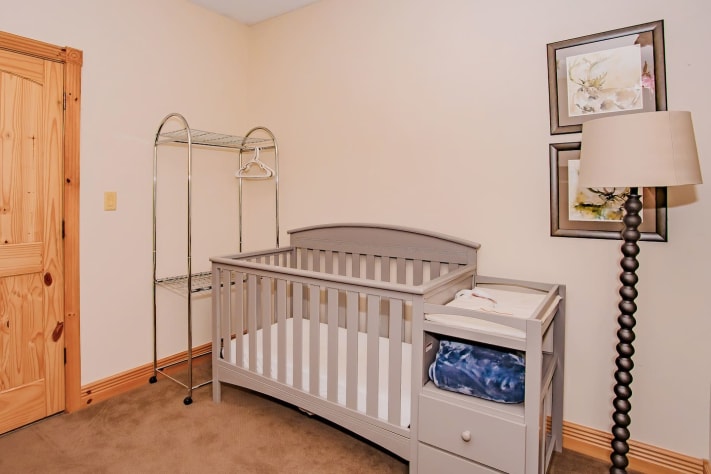 Bedroom with bunk beds and crib connects to master bathroom Pigeon Forge, Tennessee Cabin Rental - Gallery Image #25