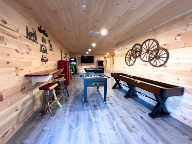 Foosball, shuffle board, TV, bar area all located in the basement! Sevierville, Tennessee Cabin Rental - Gallery Image #16