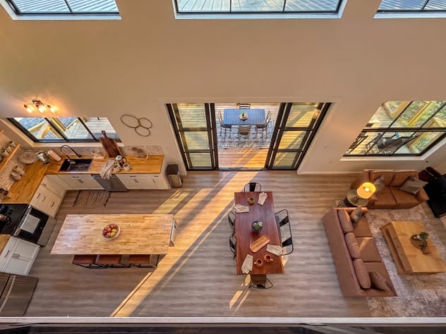 Open-concept great room from above — soaring ceilings, skylights, and a 12-foot… Douglas Lake, Tennessee Cabin Rental - Gallery Image #15