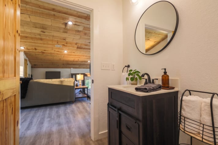 Warm wood and black-fixture finishes carried through every bathroom. Douglas Lake, Tennessee Cabin Rental - Gallery Image #36