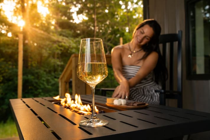 Evenings around the outdoor fire table — instant flame, no firewood to haul, lake… Douglas Lake, Tennessee Cabin Rental - Gallery Image #11
