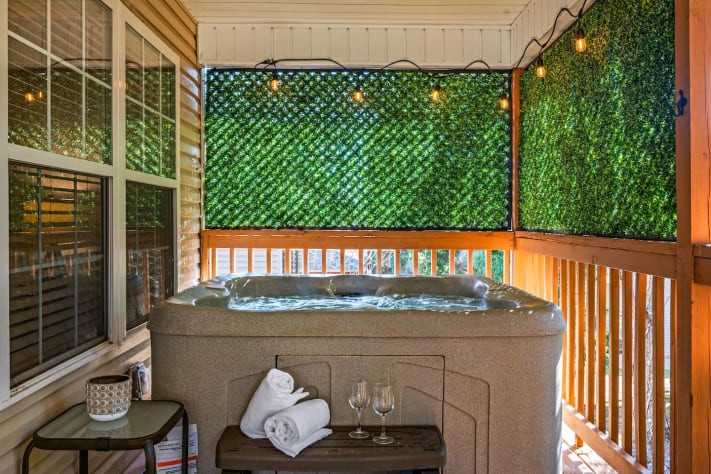 Enjoy your own private hot tub retreat, surrounded by lush greenery for added privacy.… Pigeon Forge, Tennessee Cabin Rental - Gallery Image #1