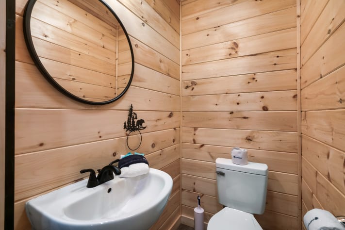 Convenient half bath on the main floor — handy for guests without heading upstairs. Sevierville, Tennessee Cabin Rental - Gallery Image #30