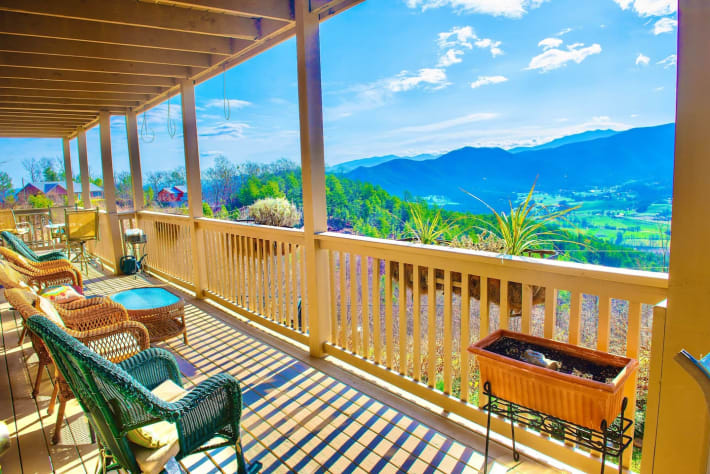 Second floor front balcony overlooking Wears Valley on a sunny day. Pigeon Forge, Tennessee Lodge Rental - Gallery Image #15