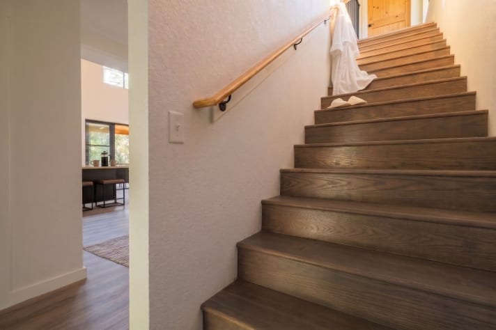Wood-and-metal staircase connecting the main floor and the loft. Douglas Lake, Tennessee Cabin Rental - Gallery Image #32