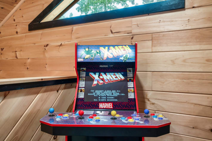 Battle it out on the classic X-Men arcade cabinet, tucked under the skylight in… Sevierville, Tennessee Cabin Rental - Gallery Image #13